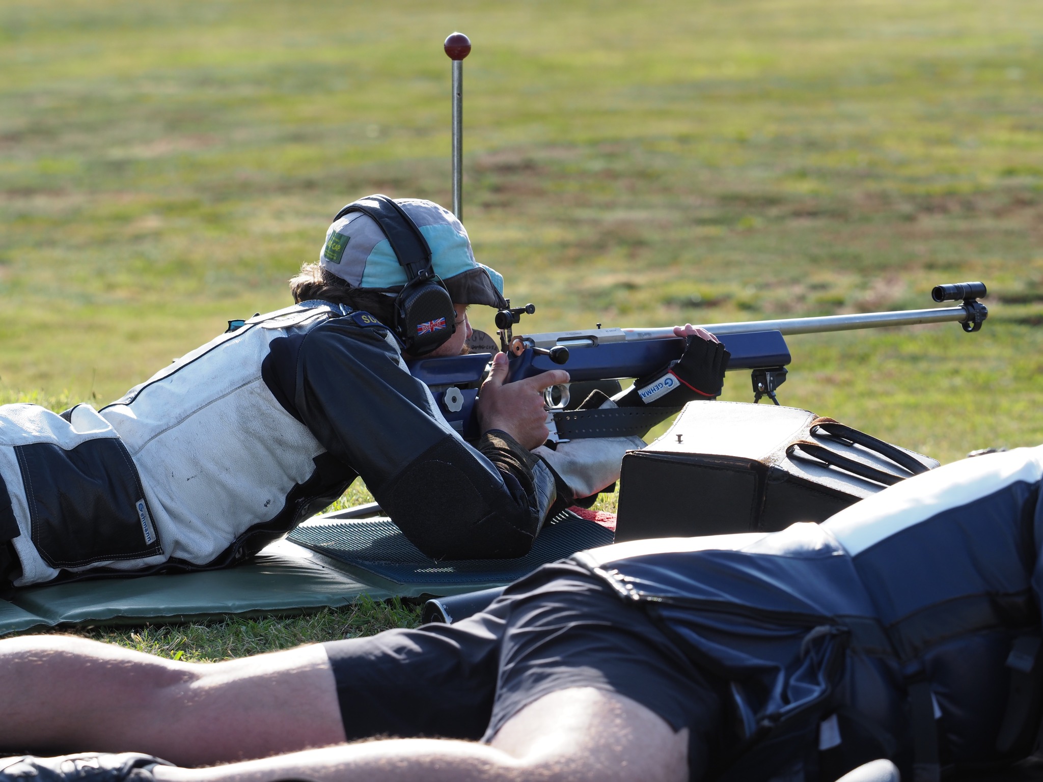 Russell sporting a nice duo of mustache and leather shooting box in St. George’s Final
