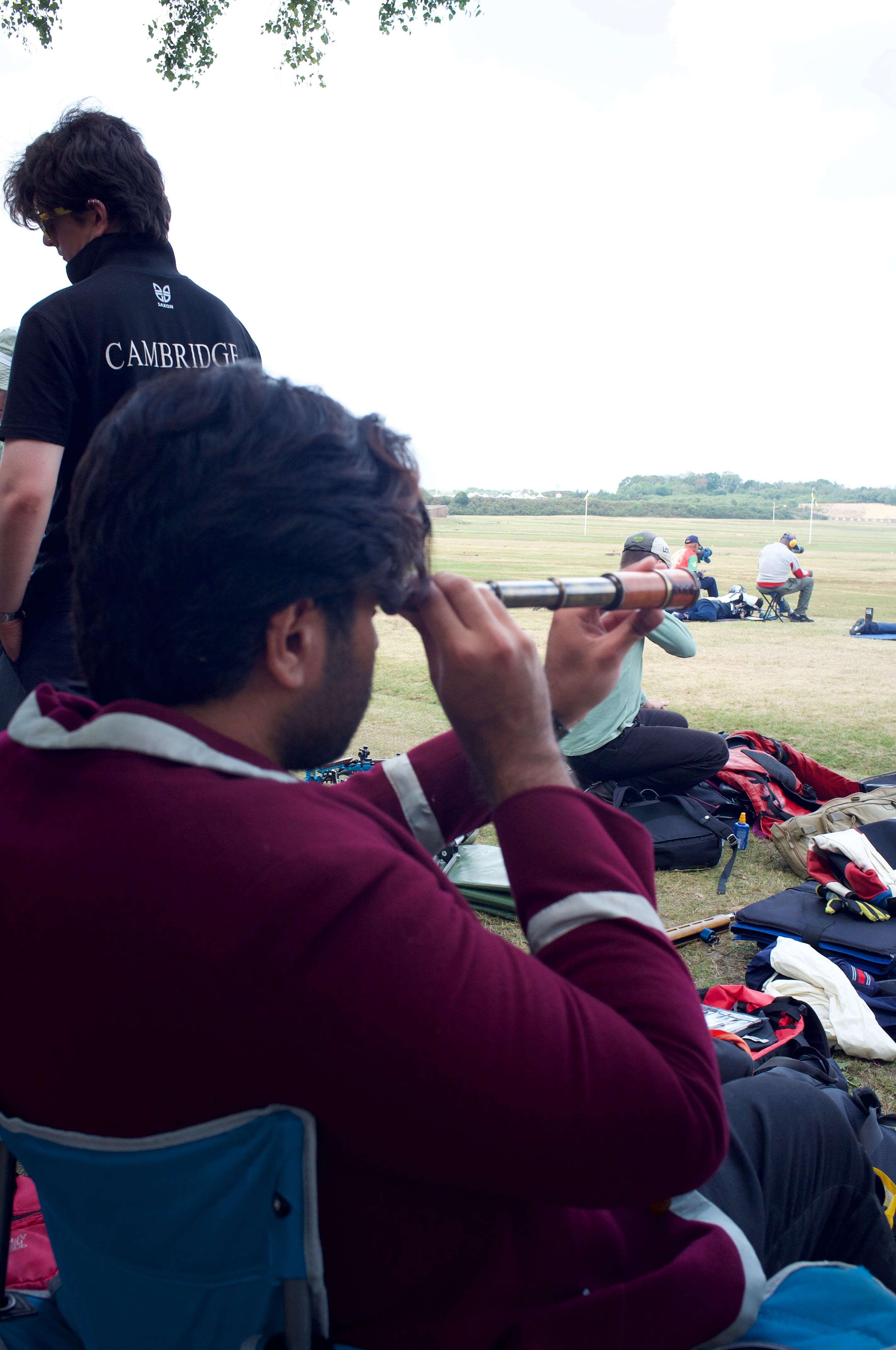 Short on spotting scopes, some behind the point were forced to improvise