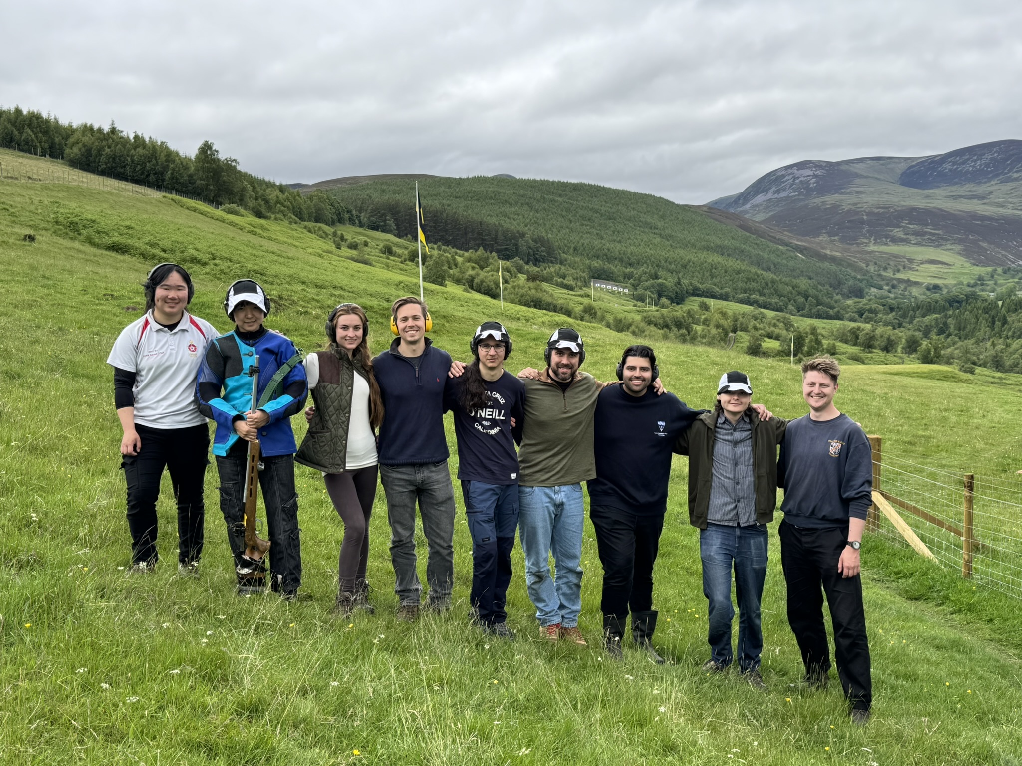 The CURA team at the 2025 Scottish Open with the Highlands behind them